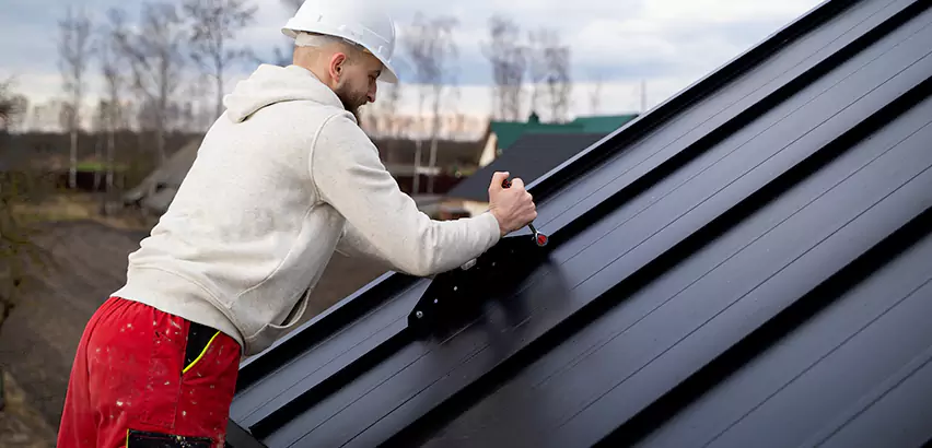 Tin Roof Ridge Cap Installation in Beloit